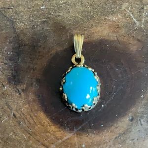 Small 14K gold pendant with stone